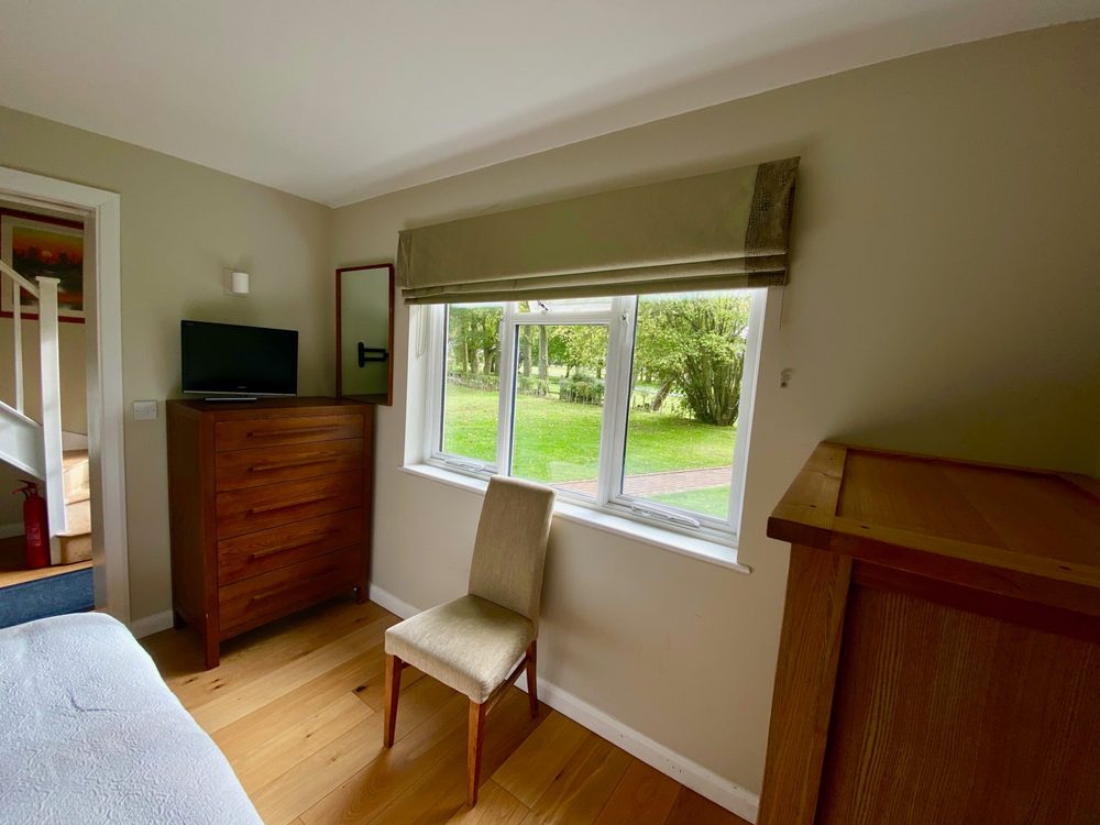 The double bedroom, looking out to the garden
